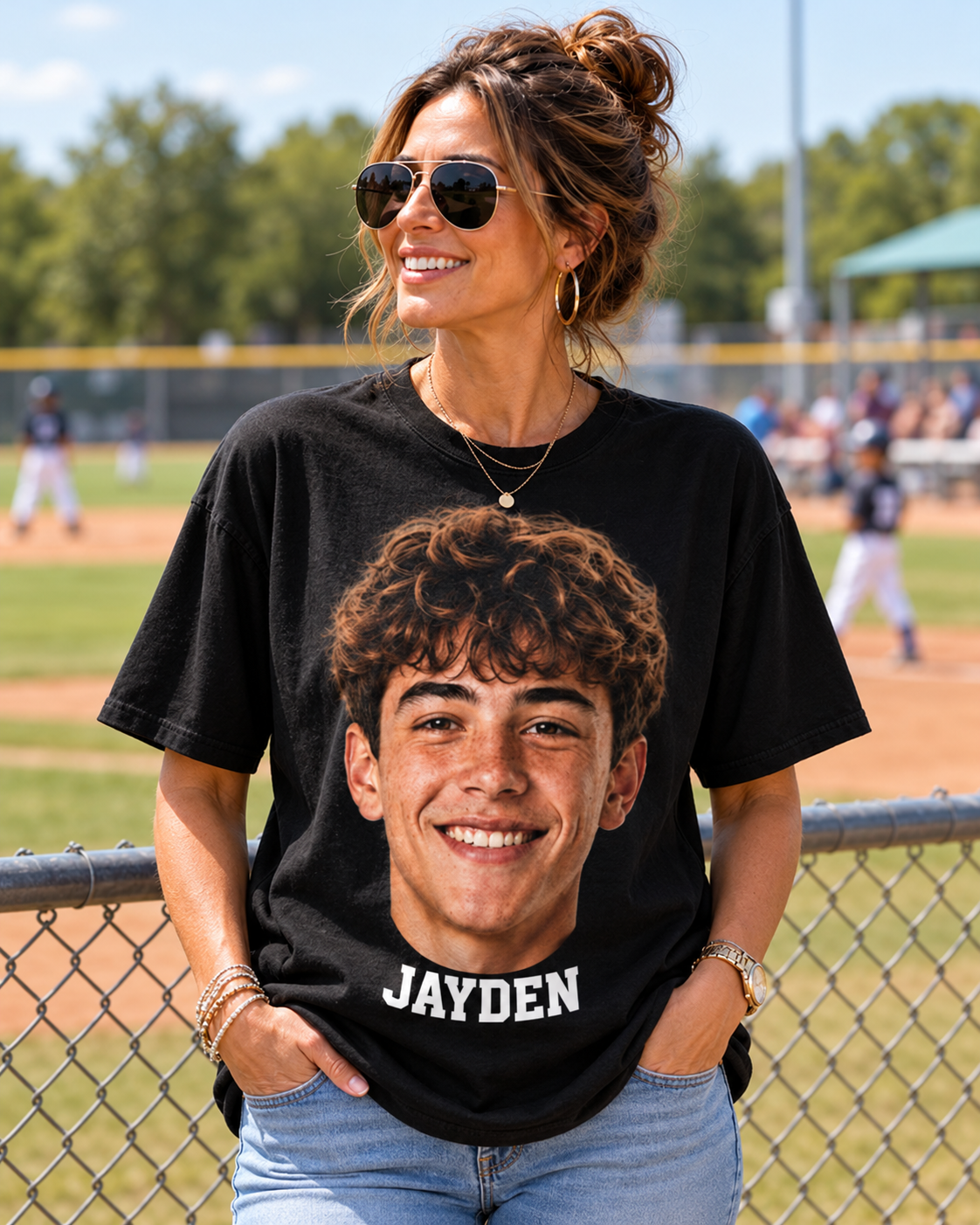 Illustrative mockup of a supporter wearing a black shirt with a giant smiling face and the white name Jayden